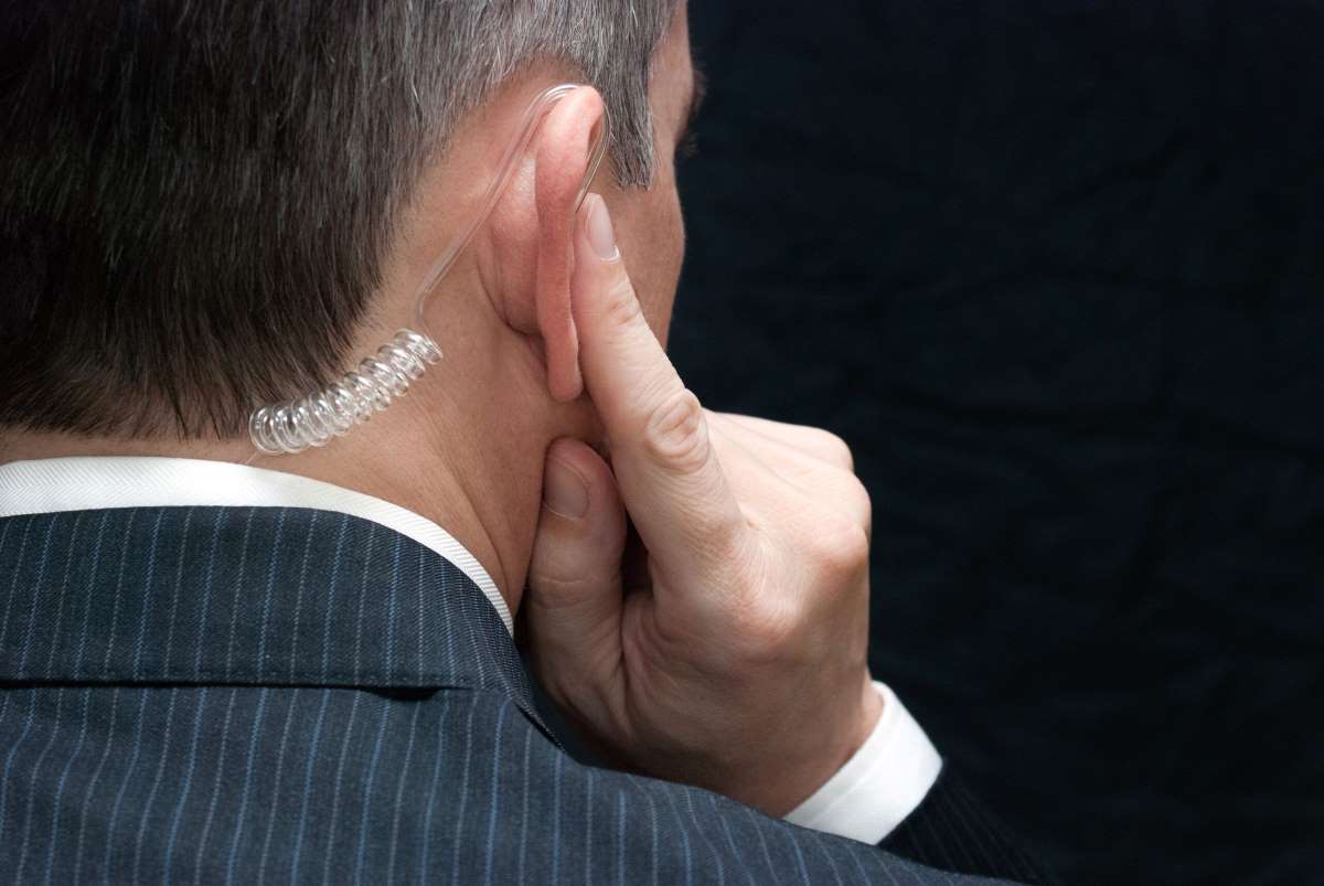 Close-up,Of,A,Secret,Service,Agent,Listening,To,His,Earpiece,
