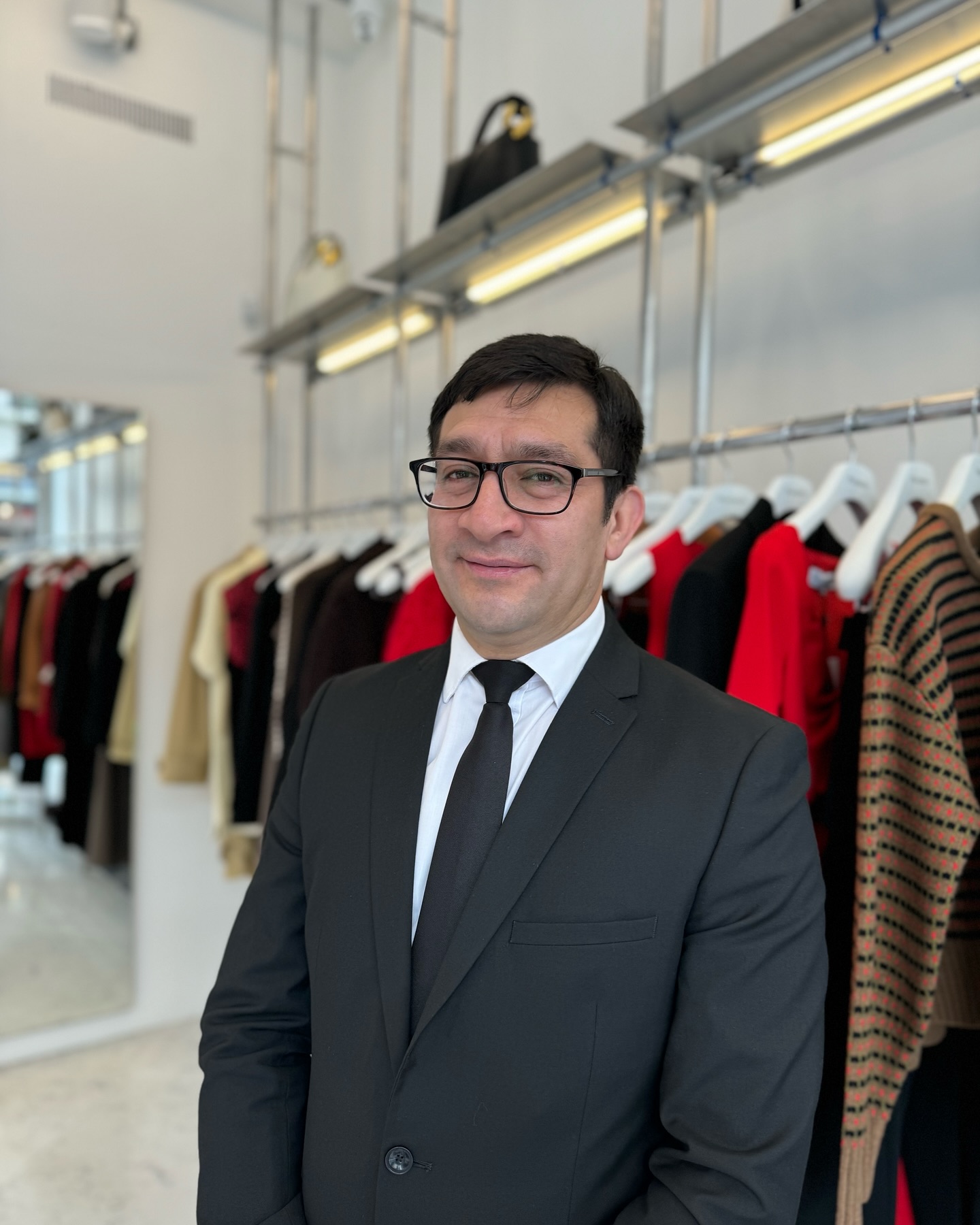 a fashion retail security officer working protecting stock staff and customers