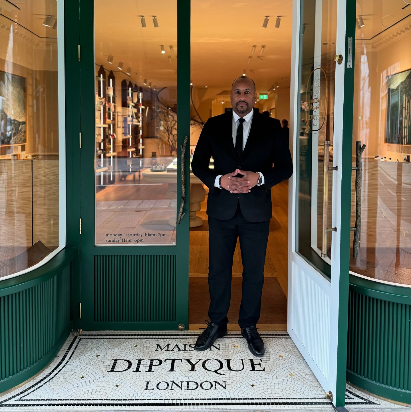 a retail security officer welcoming customers