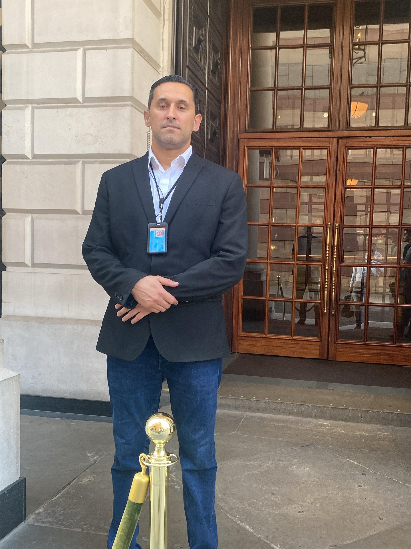 a photo of a professional security guard working at a hotel