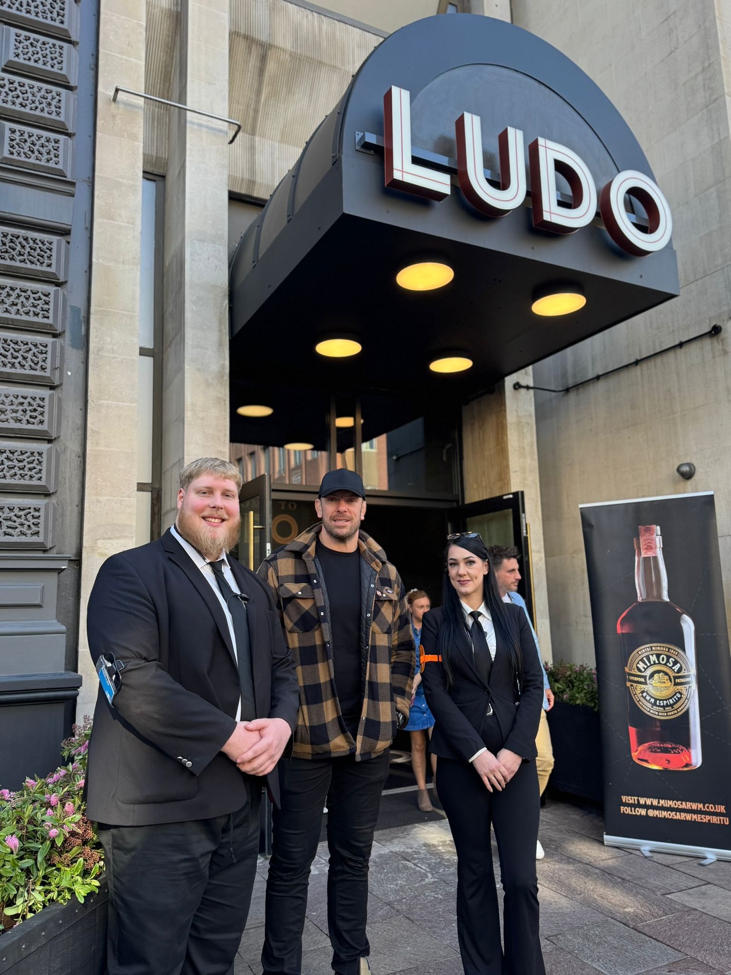 a photo of a security team standing outside of the venue called Ludo