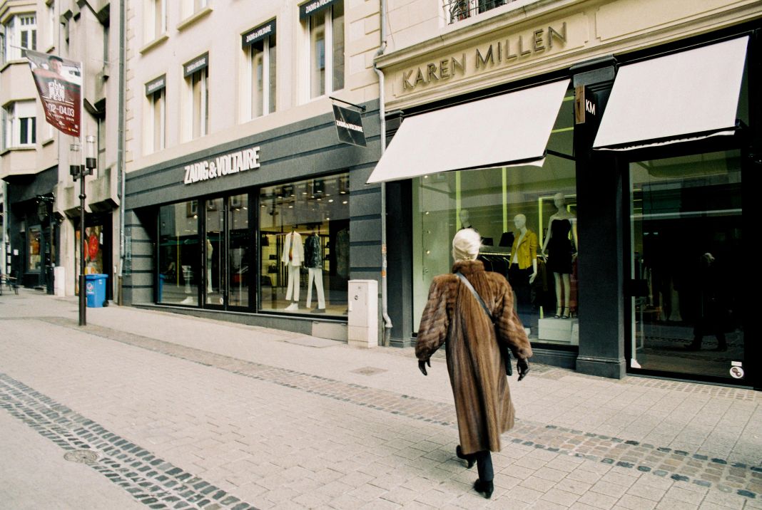 a photo of a street of designer retail shops in mayfair