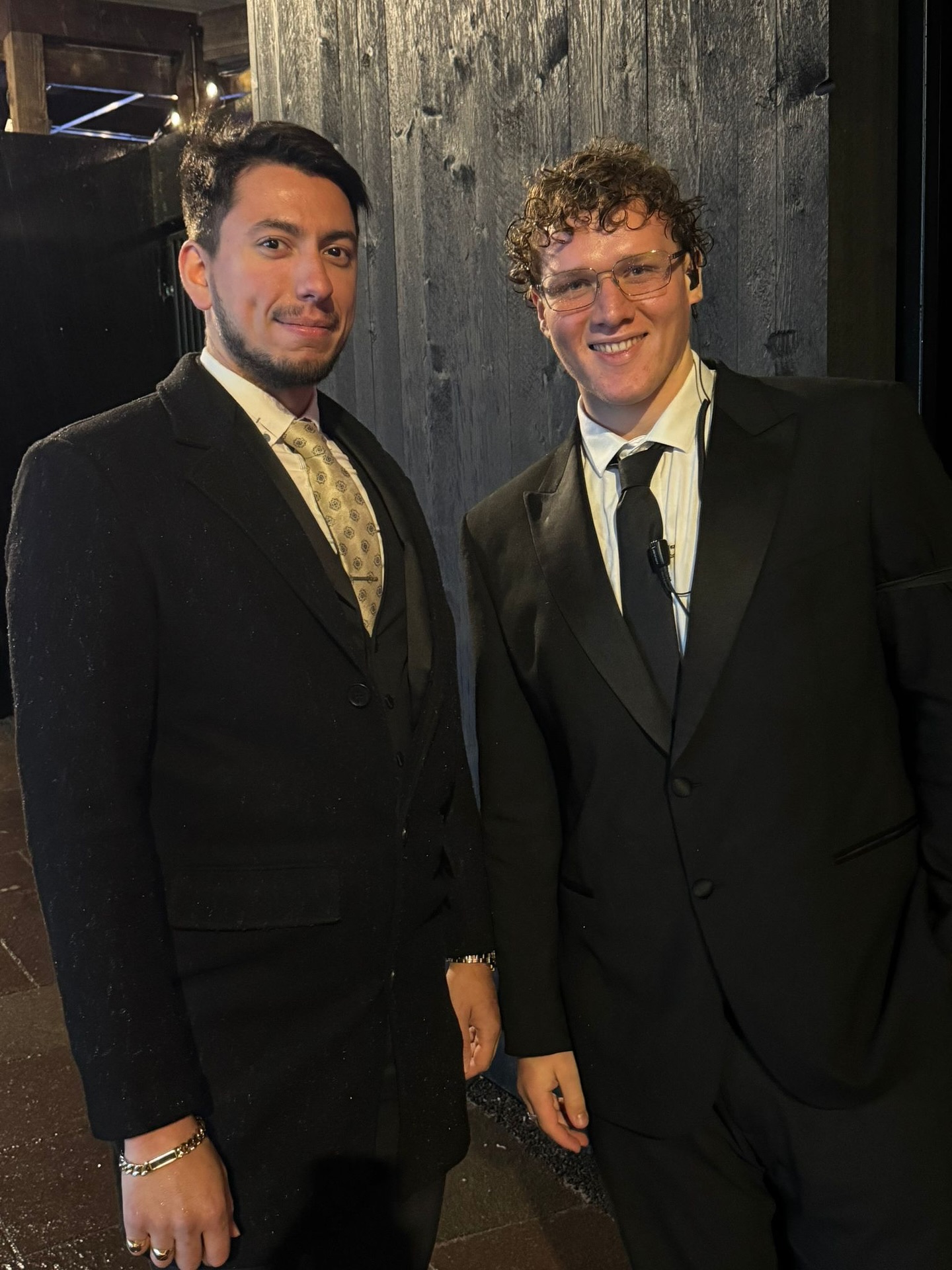 a photo of two well dressed security guards smiling