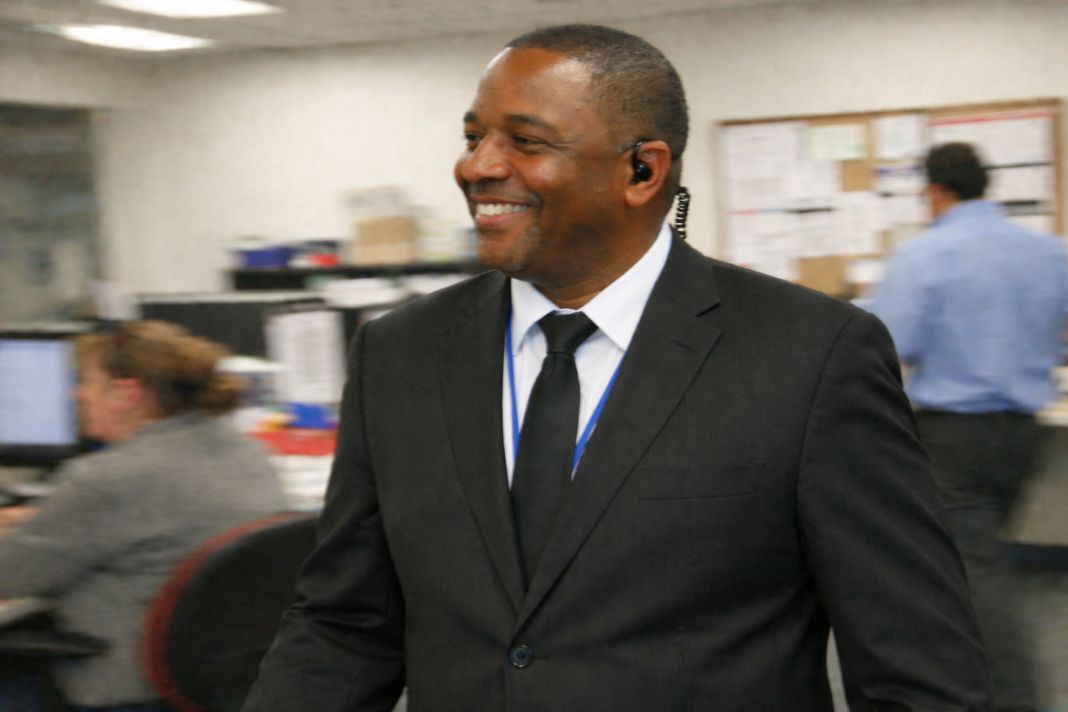 2. An ai photo of a security officer walking through an office on patrol