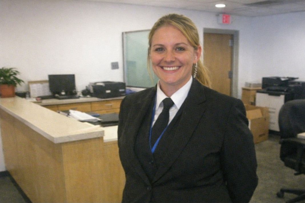 an ai photo of a female security guard in an office reception area