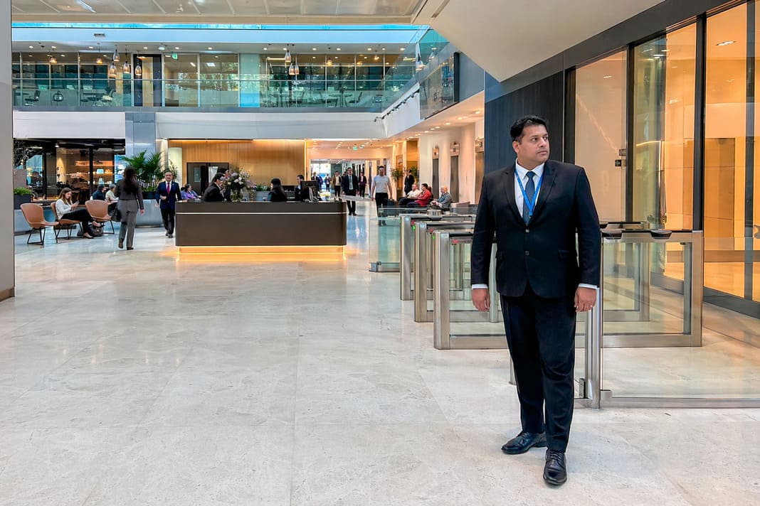 Corporate Reception Security Services In A Large Office Atrium – sample image