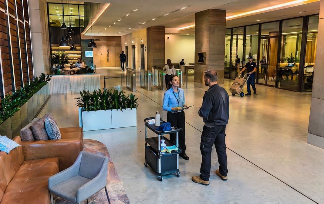 Facilities management team meeting staff at a commercial building