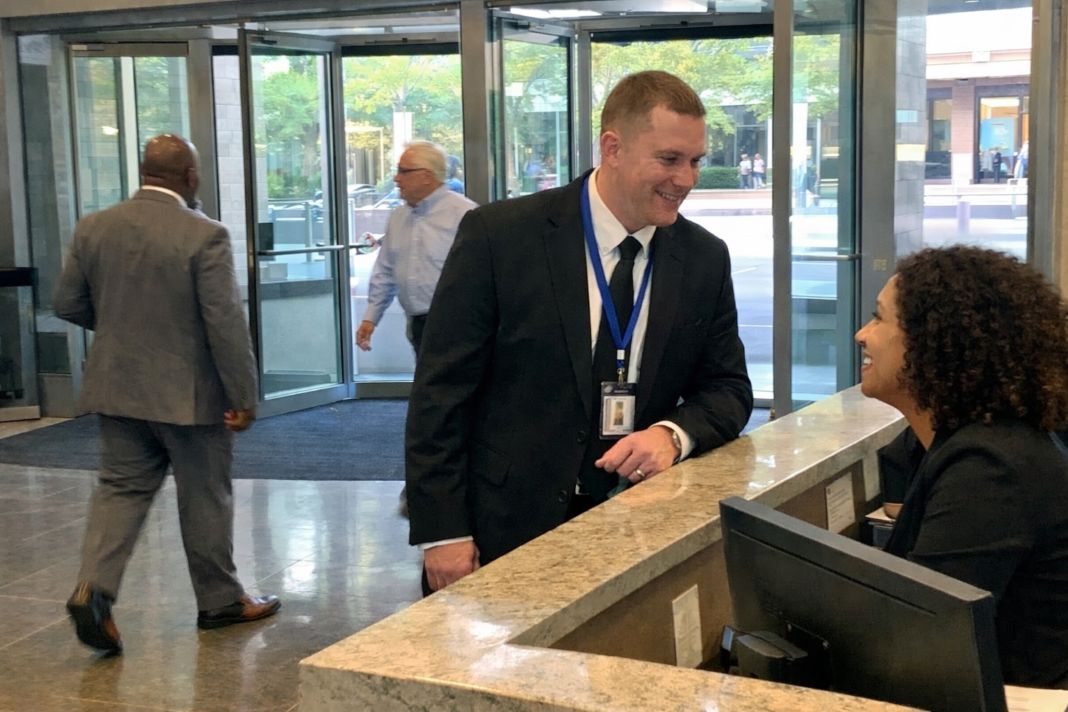 Security officer engaging with building staff on site