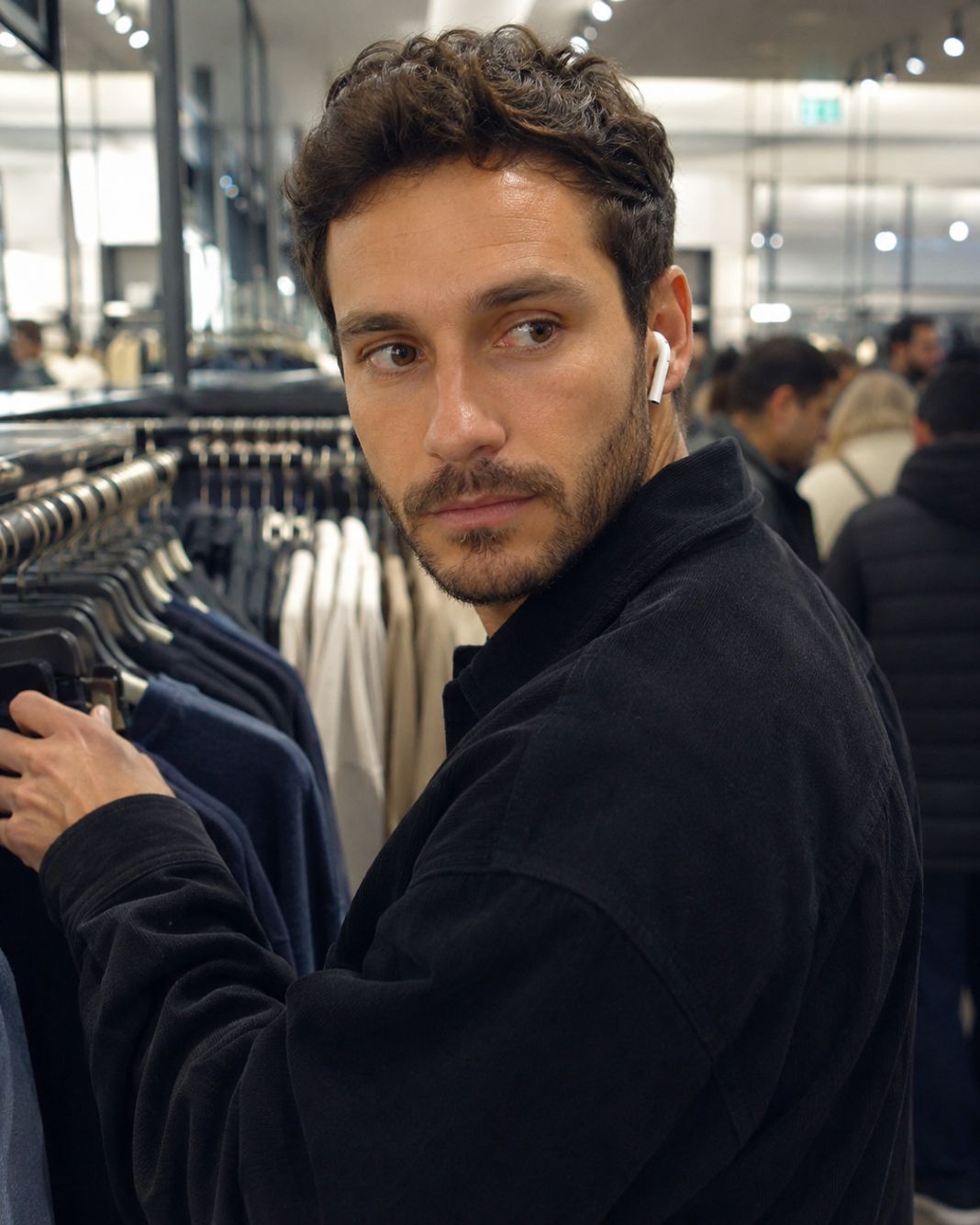 Plain-clothes store detective watching a retail shop floor