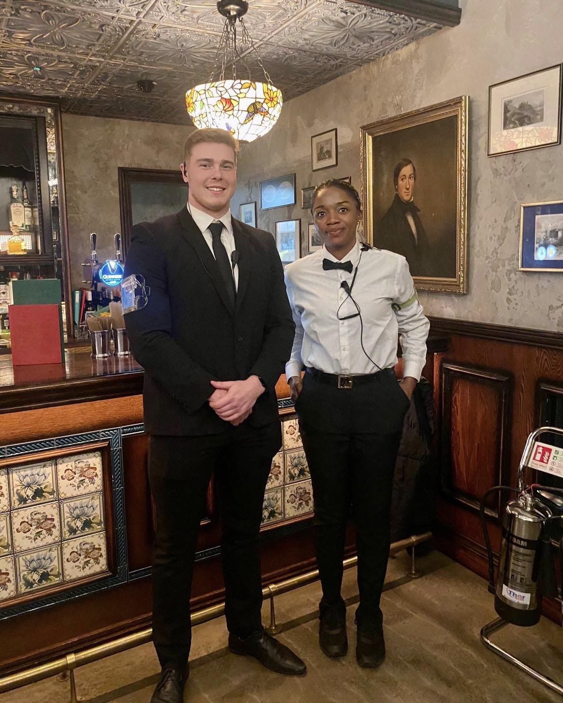 Professional SIA licensed door supervisors maintaining secure welcoming atmosphere inside busy licensed hospitality venue.