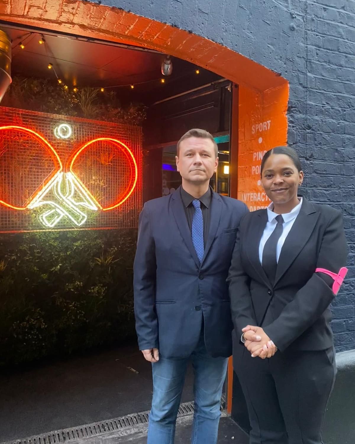SIA licensed door supervisors welcoming guests while maintaining professional venue entrance security standards consistently.