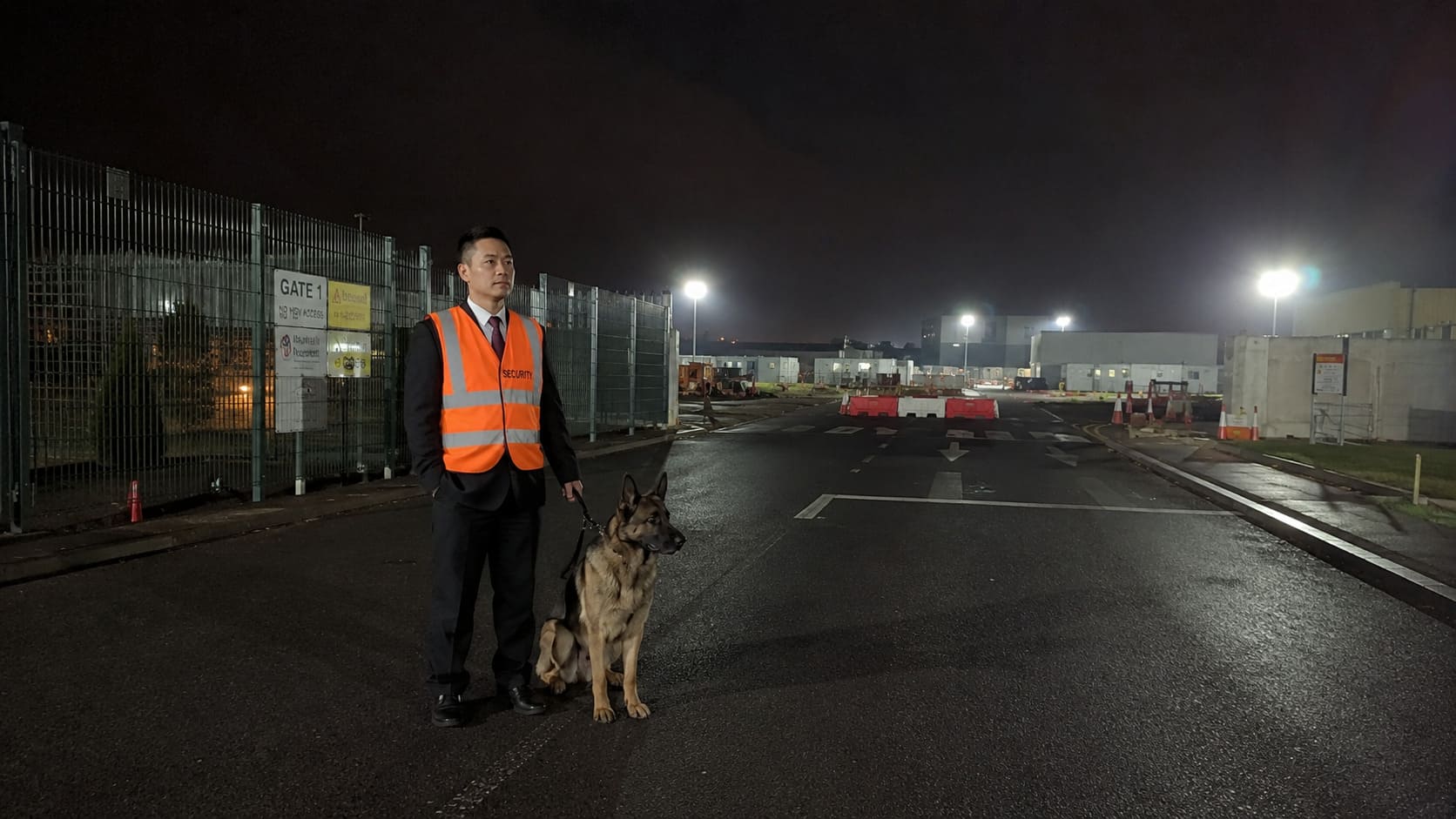 Security dog handler conducting a night-time site patrol - Illustrative Image