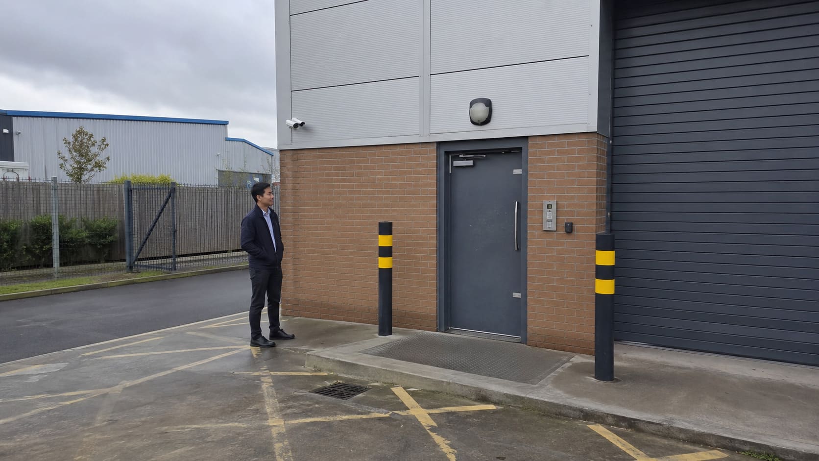 A penetration tester scoping out the external security measures of a building - Illustrative Image