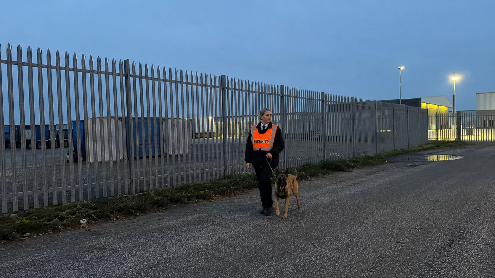 Security officer checking an industrial site perimeter - Illustrative Image