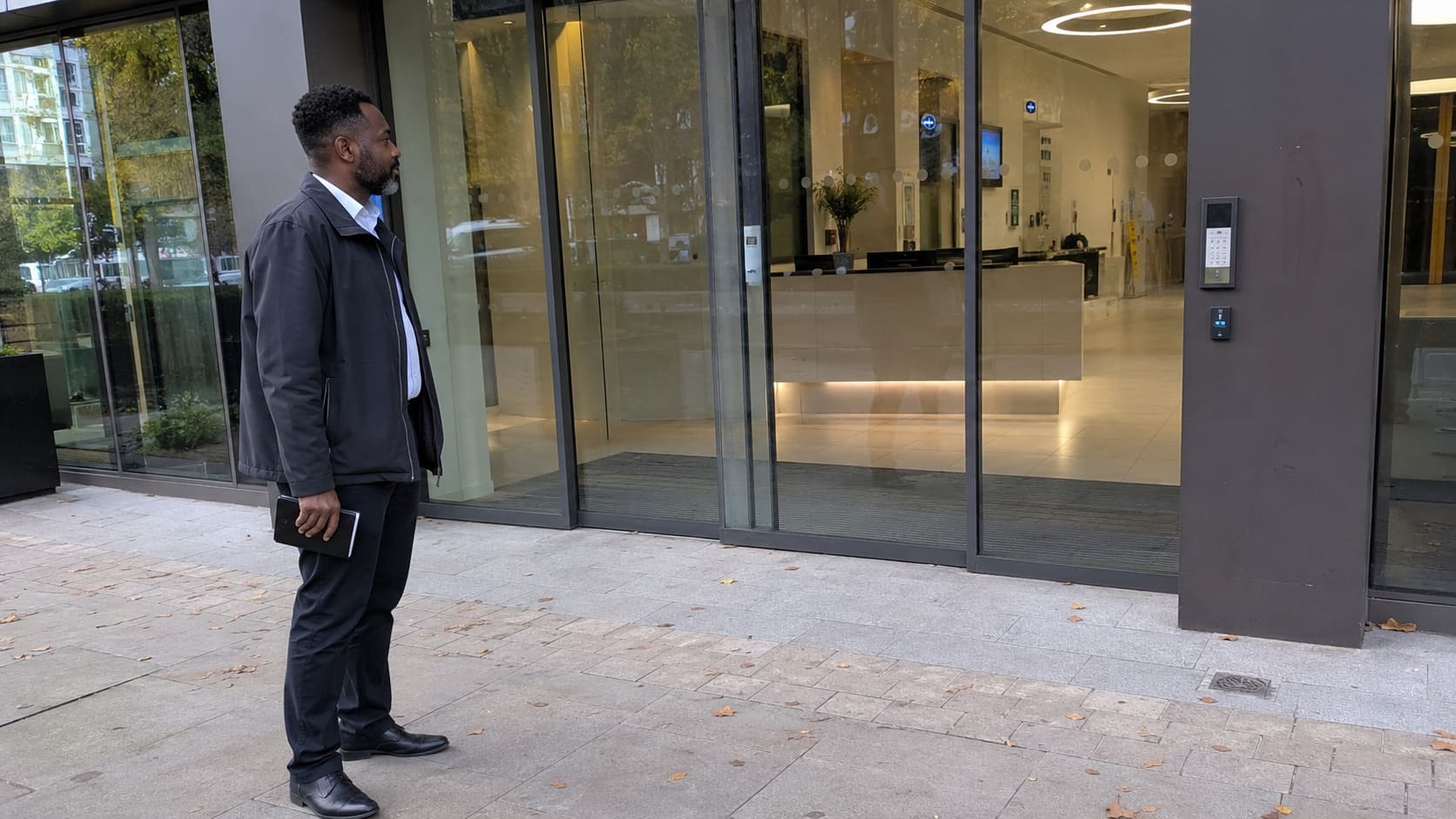 A penetration tester looking about to test the security of a building