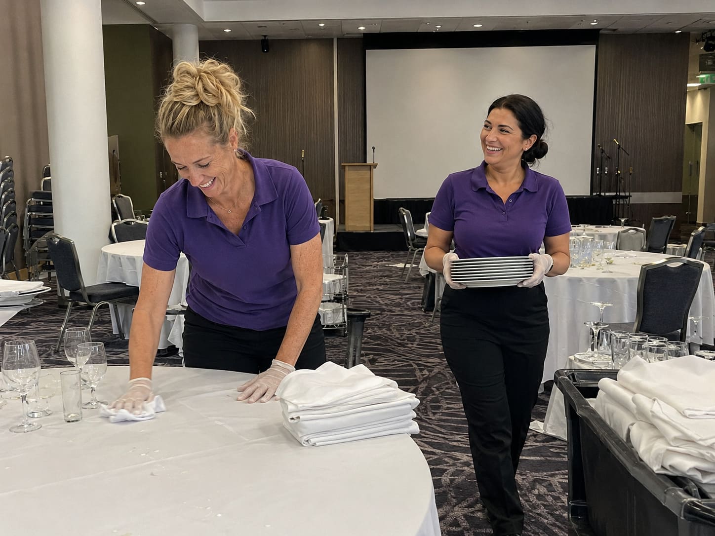 Hotel housekeeping team cleaning guest room surfaces Hotel housekeeping team cleaning guest room surfaces