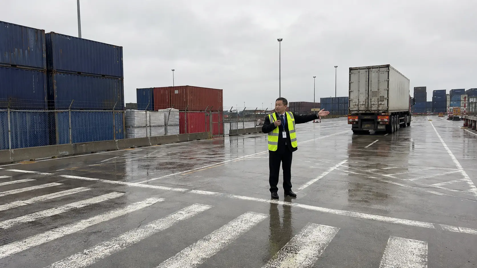 Security officer directing traffic in logistics yard - Illustrative Image